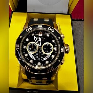 Invicta Black and Gold Chronograph Timepiece